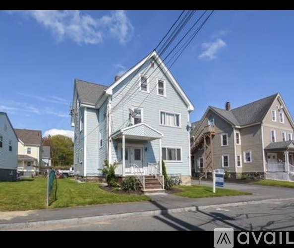 A house with a blue exterior is available for sale.