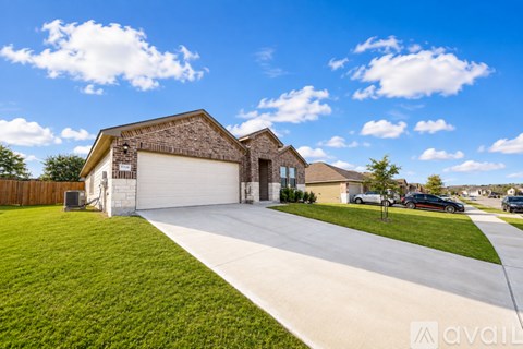A house with a driveway in front of it.