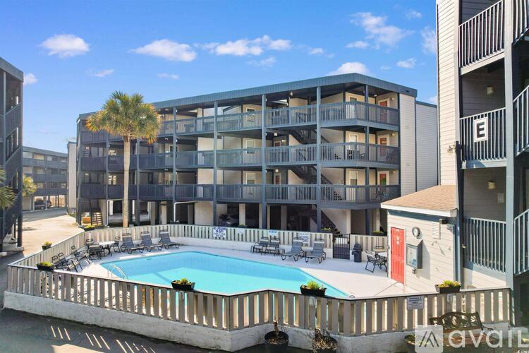 Apartments with a pool in front.