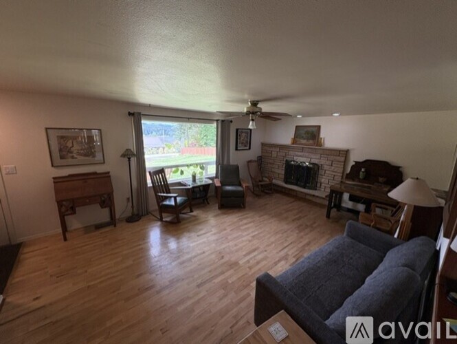 A living room with a fireplace and a couch.
