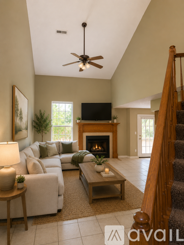A living room with a fireplace and a television.