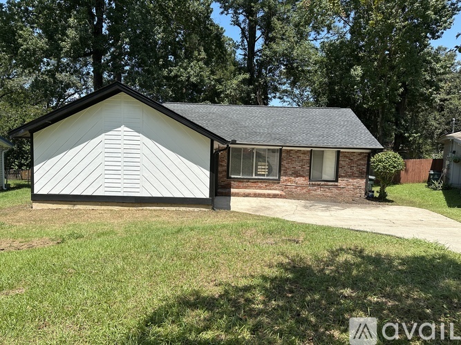 A house with a white garage door is for sale.