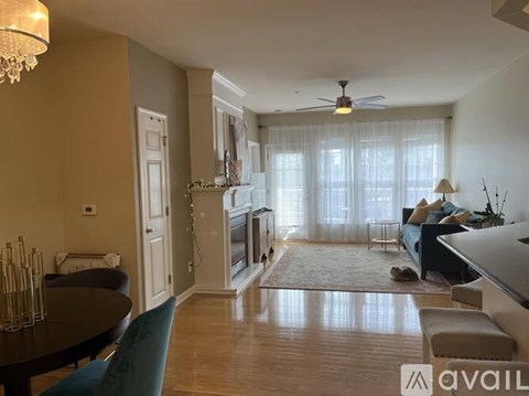 A living room with a dining table and chairs.