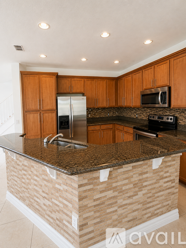 A spacious room with a ceiling fan and tiled flooring.
