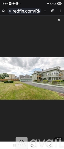 A view of a residential area with houses and a road.