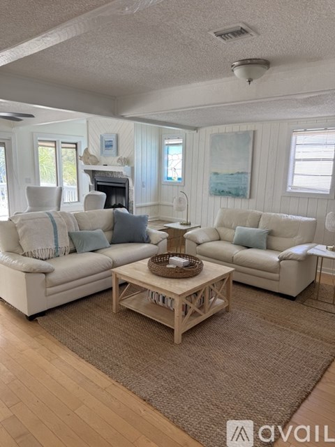 A living room with two couches and a coffee table.