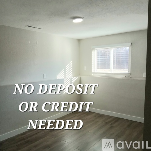 A room with a sign that says "NO DEPOSIT OR CREDIT NEEDED" in the middle of it.