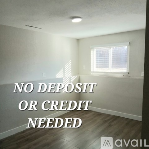 A room with a sign that says "NO DEPOSIT OR CREDIT NEEDED" in the middle of it.