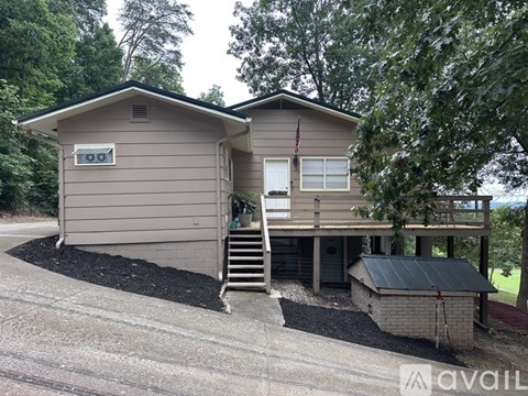 A house with a garage and a flag on the front.