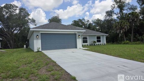 A two-car garage with a white exterior and a grey roof.