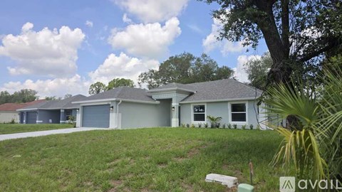A house with a garage is for sale.