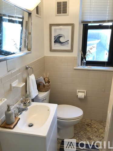 A bathroom with a white toilet and sink.