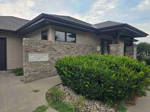 The front of a building with a sign that says "Tamarack Care Centre".