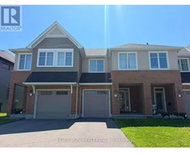 A large house with a garage is for sale.