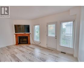 A room with a fireplace and sliding doors.