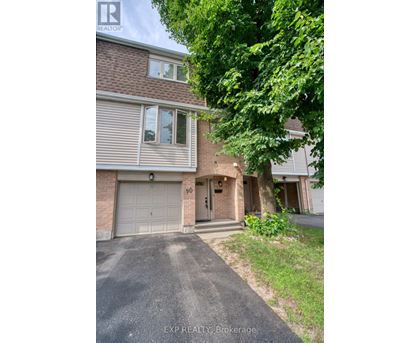 A house with a driveway and garage is for sale.