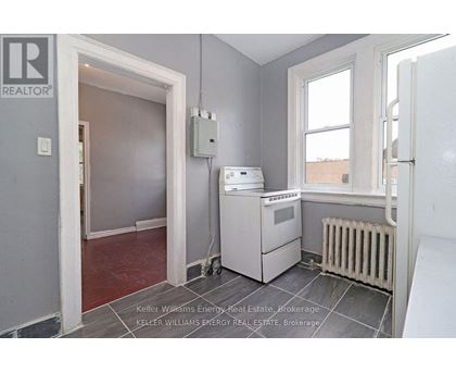 A room with a Keller Williams Energy logo on the wall.