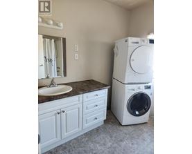 A white washer and dryer in a laundry room.