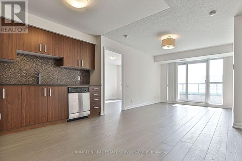 A kitchen with wooden cabinets and a stone backsplash is shown.