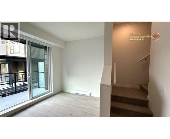A room with a staircase leading to the second floor.