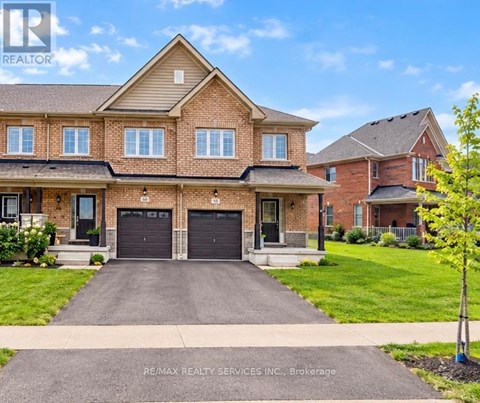 A large house with a driveway in front of it.