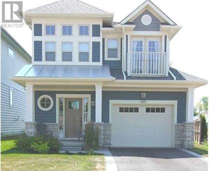 A two-story house with a balcony on the second floor.