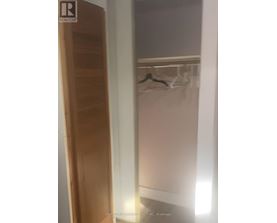 A wooden door with a glass window on the other side.