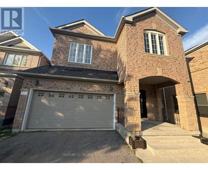 A house with a brick facade and a white garage door.