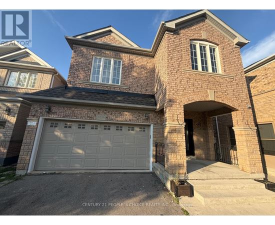 A house with a brick facade and a white garage door.