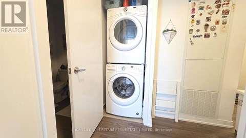 A white washer and dryer in a small laundry room.
