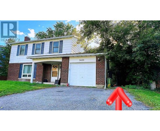 A house with a white garage door and a red arrow pointing upwards.