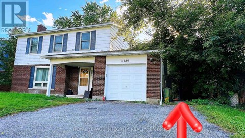 A house with a white garage door and a red arrow pointing upwards.
