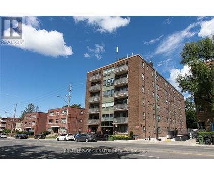 A large brick building with a balcony on the second floor.