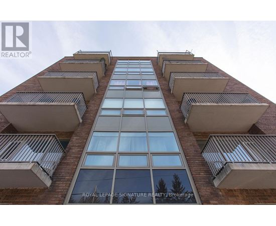 A tall building with a sign that reads "Royal LePage Signature Realty Brokerage".
