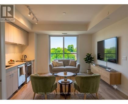 A well-lit, modern kitchen and living room with a view of the outdoors.