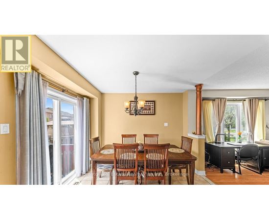 A dining room with a table set for six.