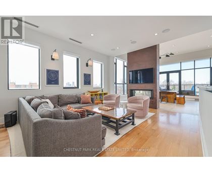A living room with a grey couch and a coffee table.