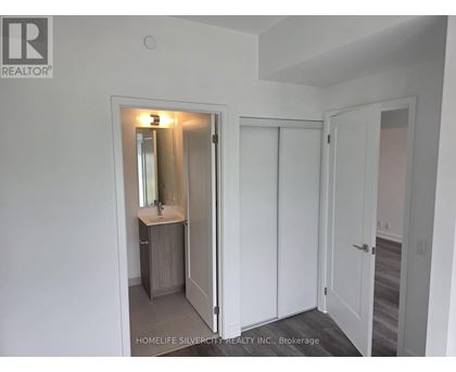 A bathroom with a sink, mirror, and medicine cabinet.