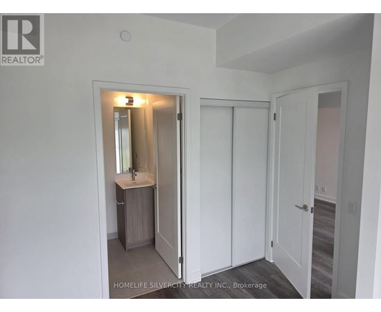 A bathroom with a sink, mirror, and medicine cabinet.