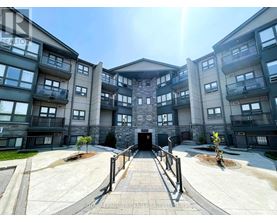 A sunny day at the entrance of a modern apartment complex.