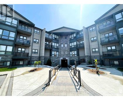 A sunny day at the entrance of a modern apartment complex.