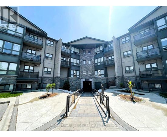A sunny day at the entrance of a modern apartment complex.