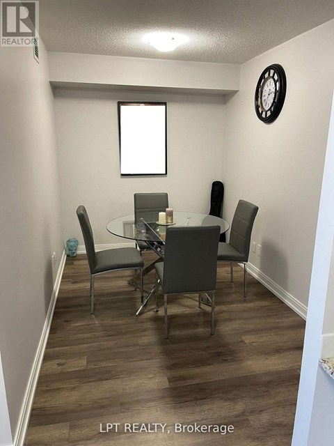 A dining room with a glass table and chairs.
