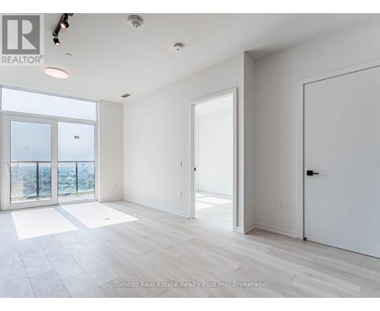 A spacious room with a view of the city from the large windows.