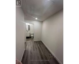 A bathroom with a toilet and sink is shown in a real estate listing.