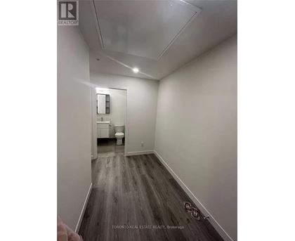 A bathroom with a toilet and sink is shown in a real estate listing.