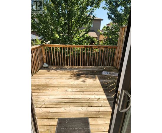 A wooden deck with a plaque on the floor.