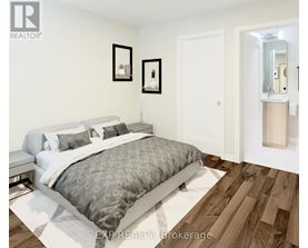 A bedroom with a bed, nightstand, and mirror.