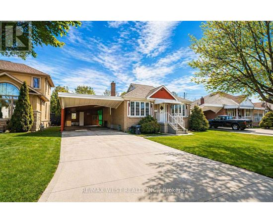 A large house with a driveway in front of it.