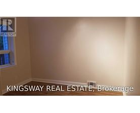 A Kingsway Real Estate Brokerage logo is displayed on a wall.